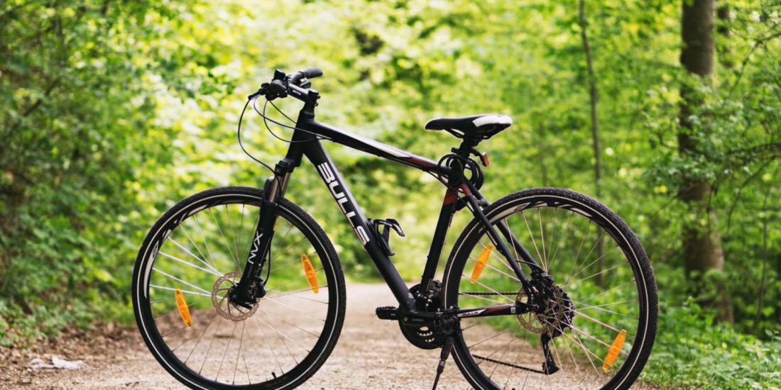 Bicycle in the woods on a dirt road