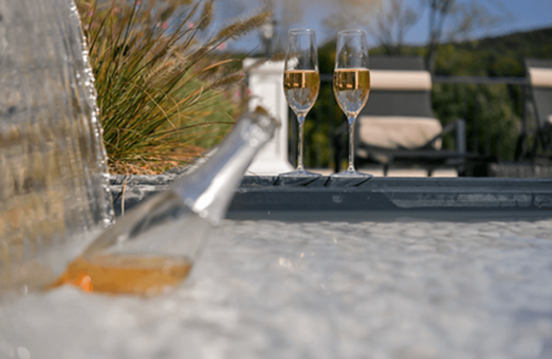 Sparkling wine in front of the pool